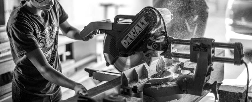 A young apprentice learning to cut on a saw bench